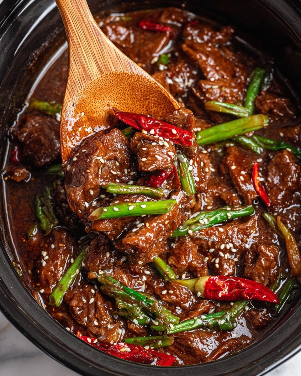 This image shows a close-up of a rich brown beef stew with a thick sauce, filled with tender-looking beef pieces as the main layer. Mixed in are layers of bright green stalks, likely green onions or scallions, and glossy red chili peppers scattered throughout. Cooked onion slices add a translucent light brown layer, blending with the sauce. White and black sesame seeds are sprinkled evenly across the dish’s surface. A bamboo wooden spoon lifts a portion of the stew, highlighting the glossy texture. The stew is in a dark pot set on a white marbled surface. photo taken with an iphone --ar 4:5 --v 7
