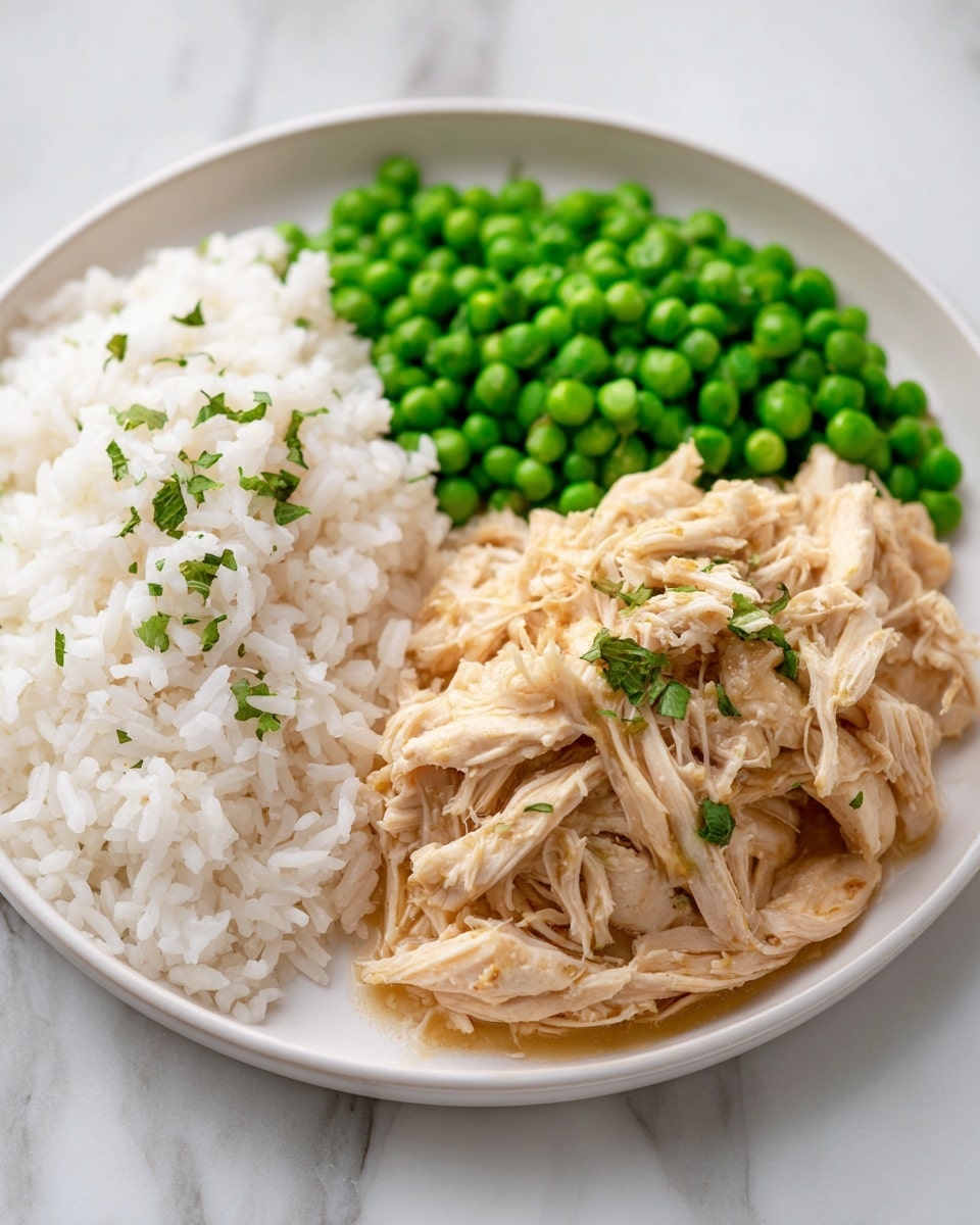 The image shows a close-up of shredded chicken mixed in a creamy, light beige gravy with a smooth texture, visible specks of black pepper, and small chopped green parsley scattered on top. A silver spoon stirs the thick sauce, lifting some chicken pieces. The background is a white marbled texture. photo taken with an iphone --ar 4:5 --v 7
