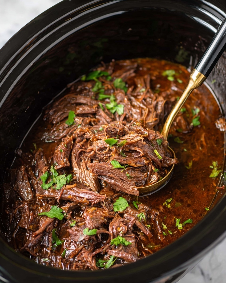 The image shows a close-up of a slow cooker filled with shredded beef in a rich, dark brown sauce, with visible juicy and tender meat fibers. Small green parsley leaves are scattered across the top, adding a touch of fresh color. A gold and black ladle is partially dipped into the meat on the right side, lifting some of the shredded beef. The inside of the slow cooker is black and glossy, contrasting with the dark meat and vibrant parsley, all set against a white marbled surface. photo taken with an iphone --ar 4:5 --v 7