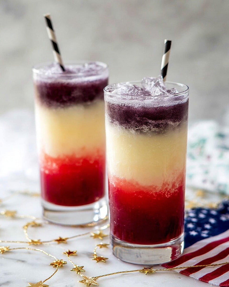 Two tall clear glasses each hold a three-layered drink set on a white marbled surface. The bottom layer is bright red with a slightly chunky texture, the middle layer is creamy pale yellow and smooth, and the top layer is thick and deep purple with a frosty look. A black and white striped paper straw is in the glass in the front. Some small white flowers lie scattered on the surface nearby. photo taken with an iphone --ar 4:5 --v 7