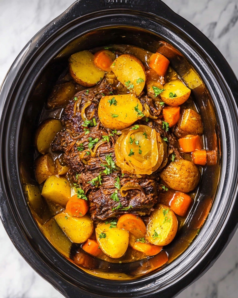 A dish inside a dark slow cooker filled with a large cooked beef roast at the center that is dark brown and textured with some shredded pieces. Around and on top of the beef are thick slices of caramelized yellow onions. Surrounding the beef, there are multiple chunks of golden yellow potatoes and bright orange carrot pieces, all cooked and mixed with some small bits of green parsley scattered across the dish. The food sits in a light brown savory sauce that adds a shiny texture to the ingredients. The entire slow cooker rests on a white marbled surface. photo taken with an iphone --ar 4:5 --v 7